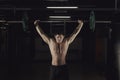 Muscular man at a crossfit gym lifting a barbell. Royalty Free Stock Photo