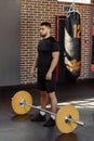 Muscular man at a crossfit gym prepare to lifting a barbell. Royalty Free Stock Photo