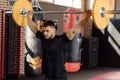 Muscular man at a crossfit gym lifting a barbell. Royalty Free Stock Photo