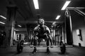 Muscular man at a crossfit gym lifting a barbell. Royalty Free Stock Photo