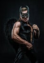Muscular man in demon costume