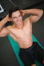 Muscular man doing abdominal crunches in gym Royalty Free Stock Photo