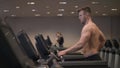 Muscular man doing cardio training on treadmill in healthy club slow motion Royalty Free Stock Photo