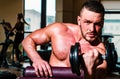 Muscular man doing crossfit. Man training with dumbbells. Dumbbell. Muscular guy exercises with dumbbells. Strong Royalty Free Stock Photo