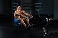 Muscular man doing exercise for legs in the gym Royalty Free Stock Photo