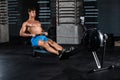 Muscular man doing exercise for legs in the gym Royalty Free Stock Photo