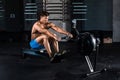 Muscular man doing exercise for legs in the gym Royalty Free Stock Photo