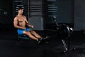 Muscular man doing exercise for legs in the gym Royalty Free Stock Photo