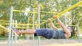 Muscular Man Doing Exercises on Horizontal Bar Royalty Free Stock Photo