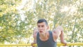 Muscular Man Doing Exercises on Horizontal Bar Royalty Free Stock Photo