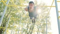 Muscular Man Doing Exercises on Horizontal Bar Royalty Free Stock Photo