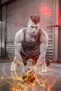 Muscular man doing pull up with medicine ball Royalty Free Stock Photo