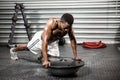 Muscular man doing push up on bosu ball