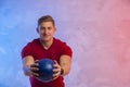 Muscular man exercise with medicine ball at health club. Fitness routine with exercise. Interactive coach concept Royalty Free Stock Photo