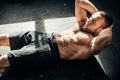 Muscular man exercising doing sit up exercise Royalty Free Stock Photo