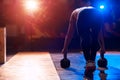 Muscular man exercising with kettle bell in gym Royalty Free Stock Photo