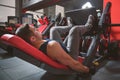 Muscular man exercising on leg press machine Royalty Free Stock Photo