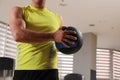 Muscular man exercising with medicine ball in gym, closeup Royalty Free Stock Photo