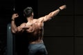 Muscular Man Flexing Back Muscles Pose Royalty Free Stock Photo