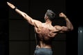 Muscular Man Flexing Back Muscles Pose Royalty Free Stock Photo