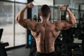 Muscular Man Flexing Back Muscles Pose Royalty Free Stock Photo