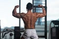 Muscular Man Flexing Back Muscles Pose Royalty Free Stock Photo