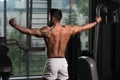 Muscular Man Flexing Back Muscles Pose Royalty Free Stock Photo