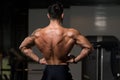 Muscular Man Flexing Back Muscles Pose Royalty Free Stock Photo