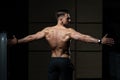 Muscular Man Flexing Back Muscles Pose Royalty Free Stock Photo