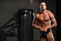 Muscular Man Flexing Muscles In Gym Royalty Free Stock Photo