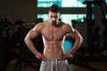 Muscular Man Flexing Muscles In Gym Royalty Free Stock Photo