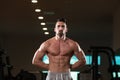 Muscular Man Flexing Muscles In Gym Royalty Free Stock Photo