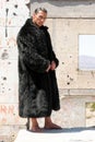 Muscular man in fur coat Royalty Free Stock Photo