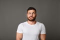 Muscular man grimacing guilty face at studio Royalty Free Stock Photo