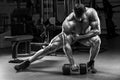 Muscular man in gym working out. Strong male bodybuilder Royalty Free Stock Photo