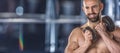 Muscular man holding dumbbell in fitness gym Royalty Free Stock Photo