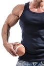 Muscular man holding football or rugby ball Royalty Free Stock Photo