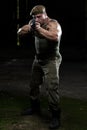 Muscular Man Holding Machine Gun Royalty Free Stock Photo