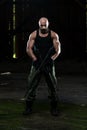 Muscular Man Holding Machine Gun Royalty Free Stock Photo