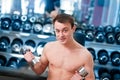 Muscular man lifting dumbbell Royalty Free Stock Photo