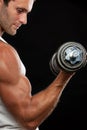 Muscular man lifting dumbbell Royalty Free Stock Photo