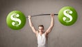 Muscular man lifting green dollar sign weights Royalty Free Stock Photo