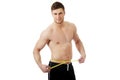Muscular man measuring his belly. Royalty Free Stock Photo