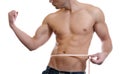 Muscular man measuring waist Royalty Free Stock Photo