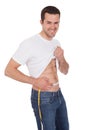 Muscular man measuring waist Royalty Free Stock Photo