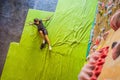 Muscular man practicing rock-climbing on a rock wall indoors Royalty Free Stock Photo