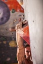 Muscular man practicing rock-climbing Royalty Free Stock Photo