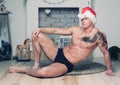 Muscular man in Santa hat Royalty Free Stock Photo