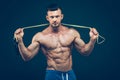 Muscular man skipping rope. Portrait of muscular Royalty Free Stock Photo