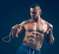 Muscular man skipping rope. Portrait of muscular Royalty Free Stock Photo